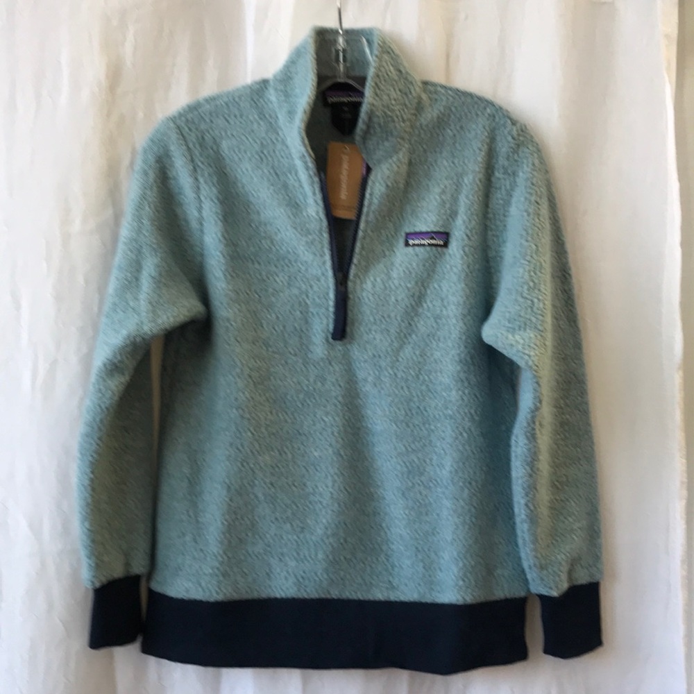 Women’s Patagonia Woolyester fleece pullover. The color is big sky blue.
